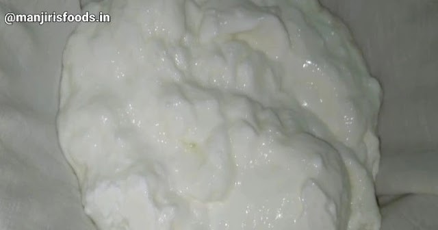 Homemade curds is kept on a muslin cloth to strain excess water