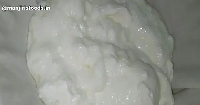 How to Make Shrikhand at Home Homemade curds is kept on a muslin cloth to strain excess water