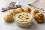 Crispy jowar flour appe served with coconut chutney on a dish