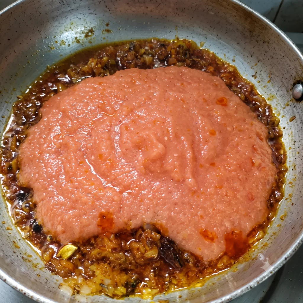 Adding tomato puree